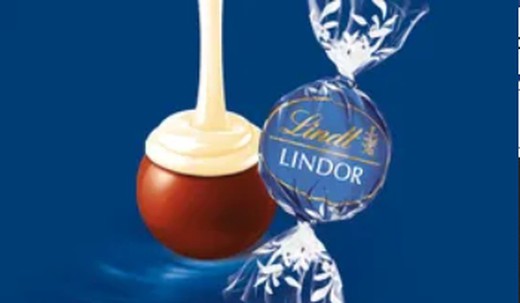 Lindor Chocolate con leche con corazon blanco (1Kg)